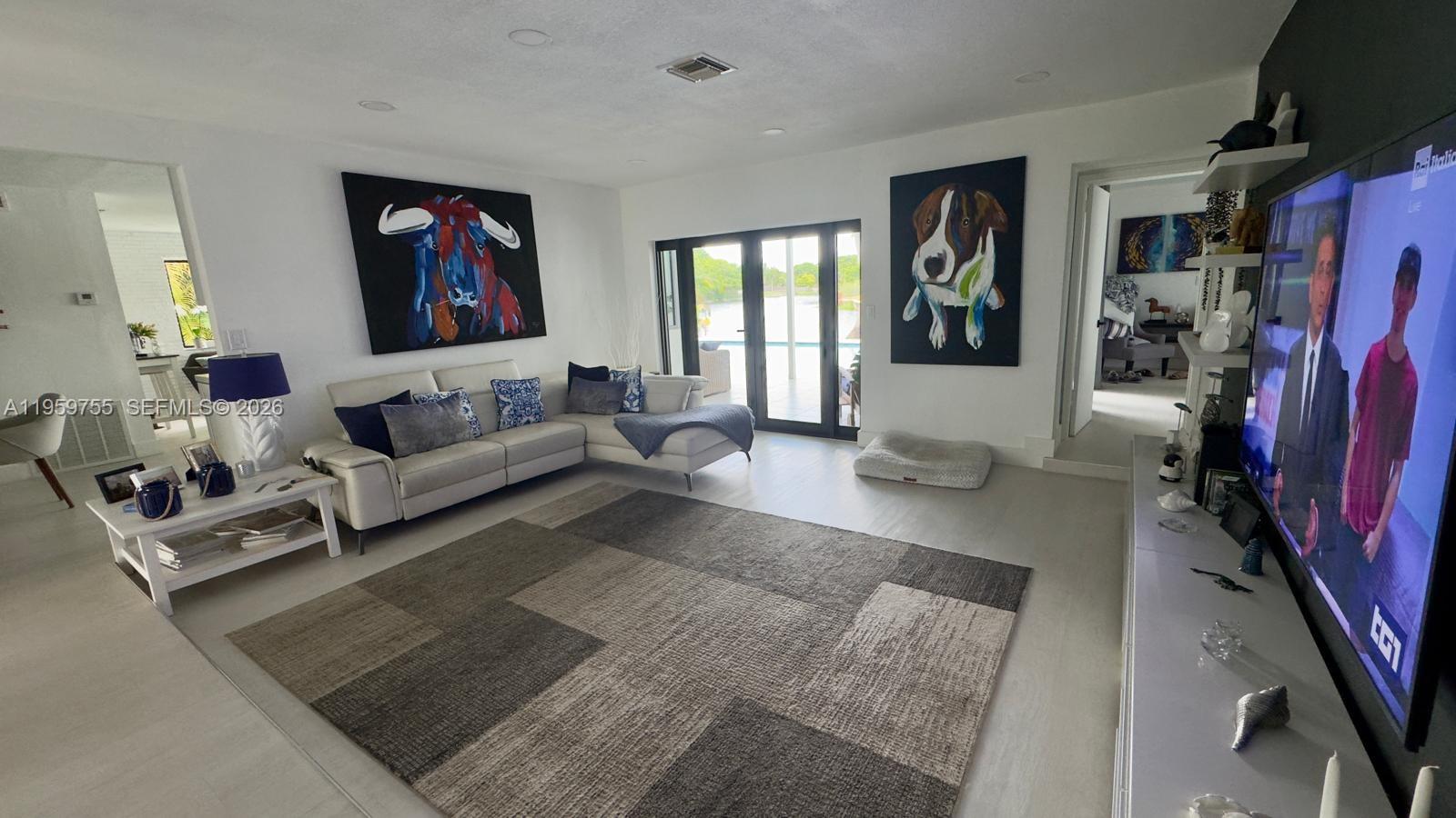 6705 Ficus Drive Miramar, FL 33023 - Photo 12 of 37 a living room with furniture and a flat screen tv