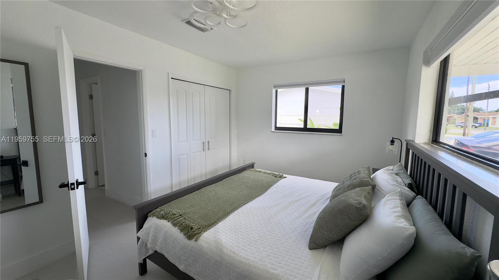 6705 Ficus Drive Miramar, FL 33023 - Photo 16 of 37 a bedroom with a bed and window