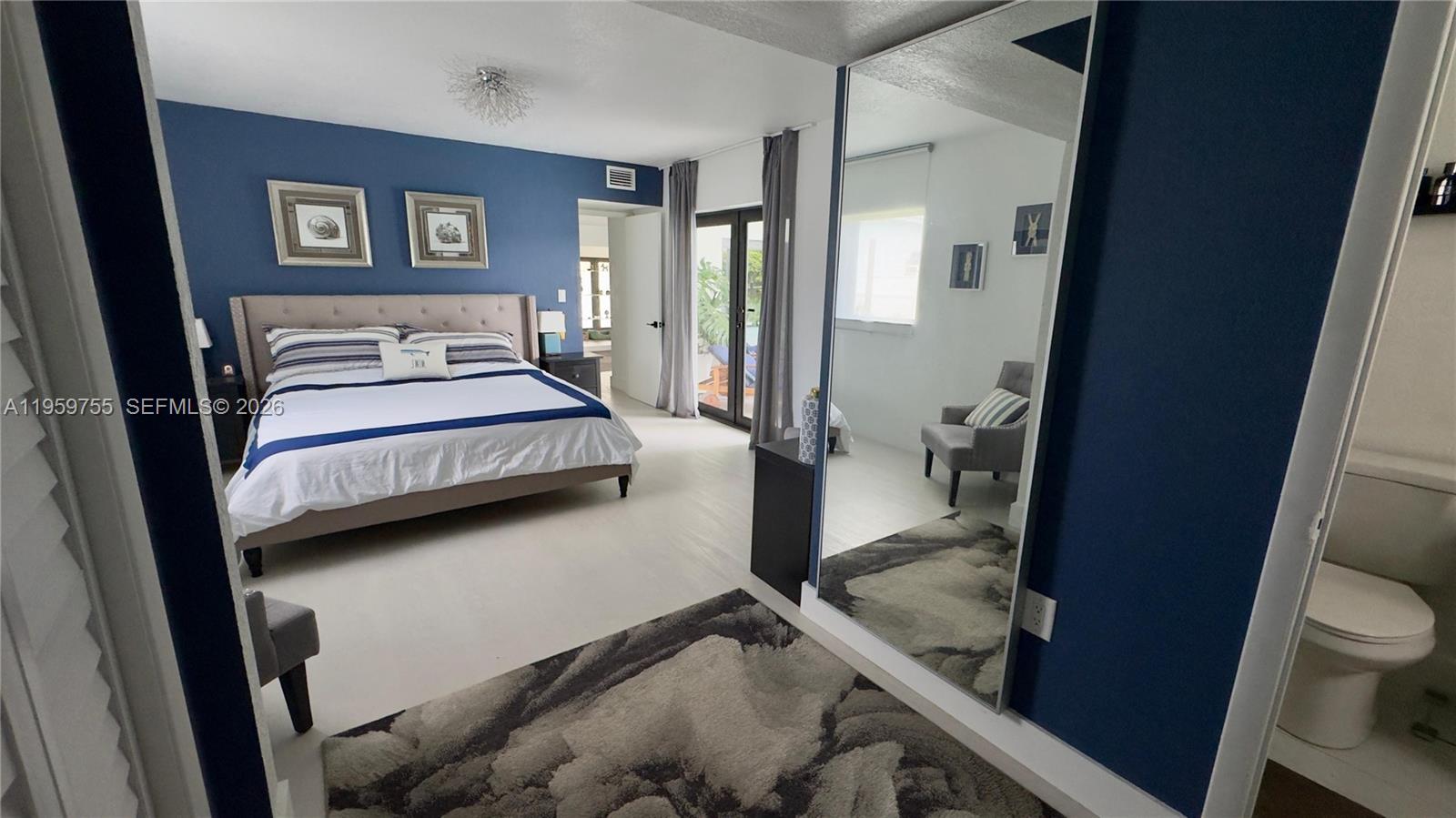 6705 Ficus Drive Miramar, FL 33023 - Photo 22 of 37 a bedroom with a bed and a view of living room