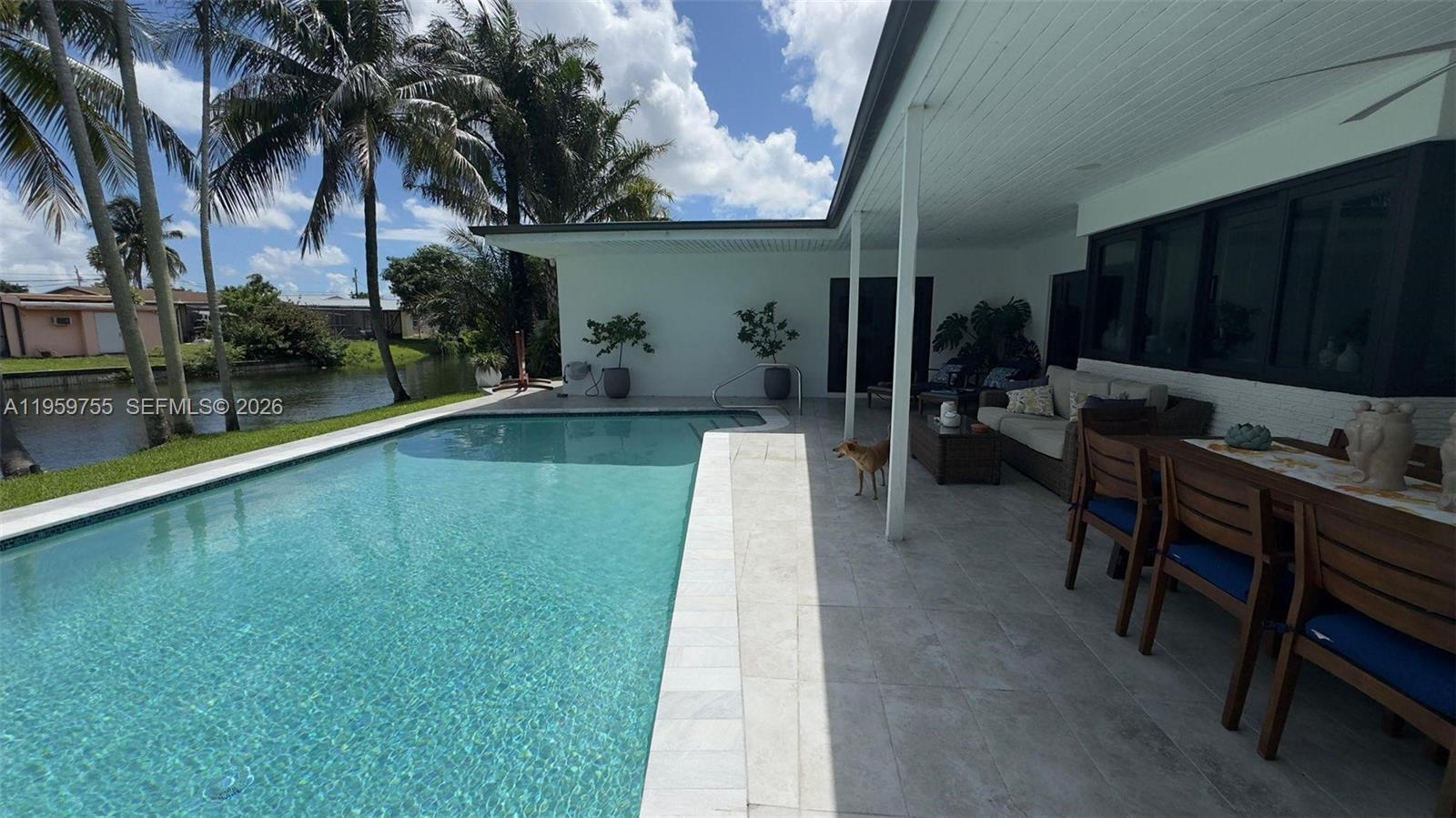 6705 Ficus Drive Miramar, FL 33023 - Photo 28 of 37 a swimming pool with outdoor seating and yard