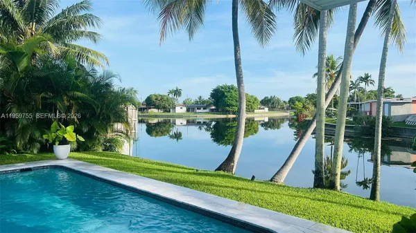 a view of a lake and a yard