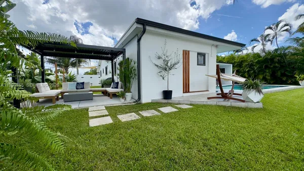 a view of a patio with a table chairs and a patio