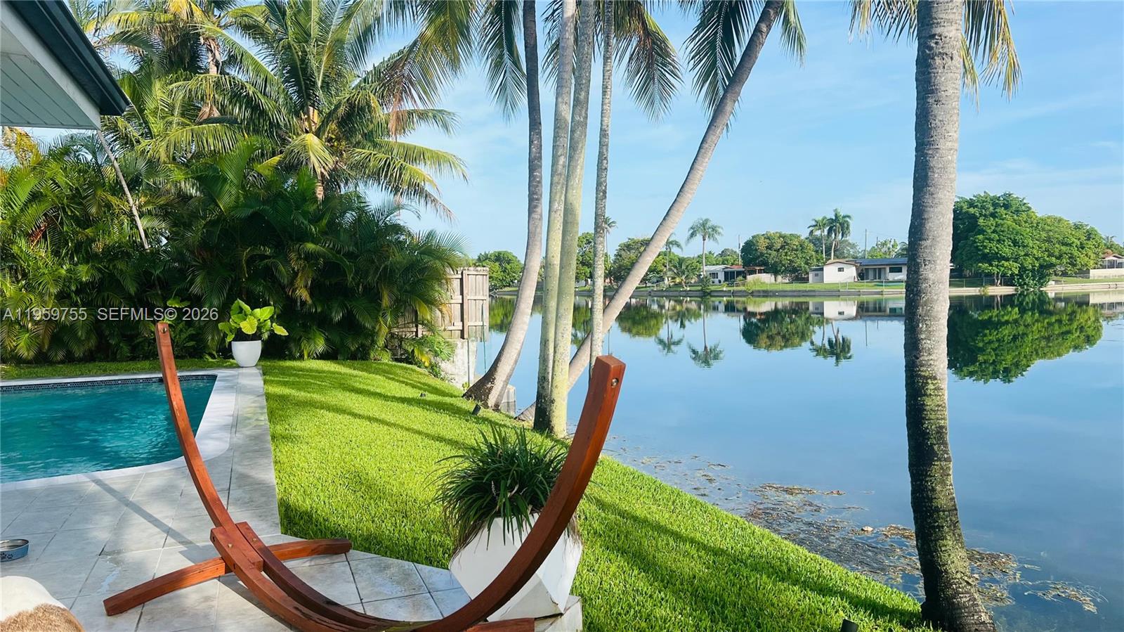 6705 Ficus Drive Miramar, FL 33023 - Photo 33 of 37 a swimming pool with outdoor seating and plants
