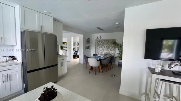 a kitchen with stainless steel appliances a refrigerator and a sink
