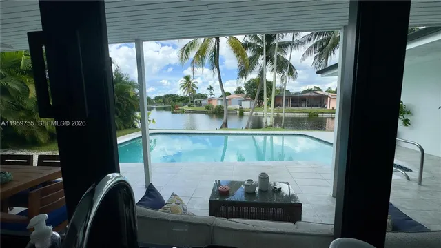 a view of a balcony with chair and table
