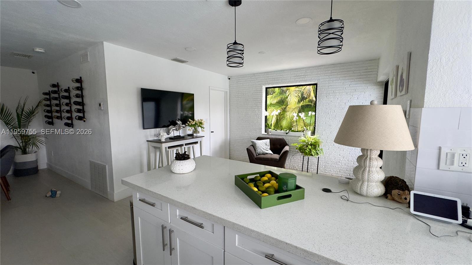 6705 Ficus Drive Miramar, FL 33023 - Photo 10 of 37 a living room with furniture and a flat screen tv
