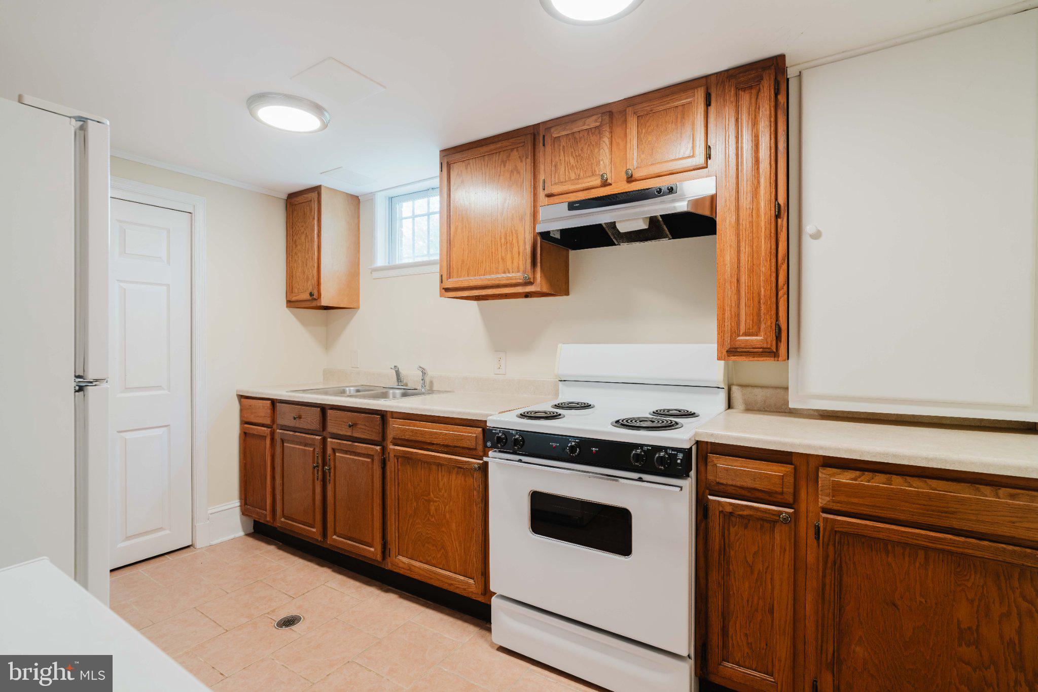 10200 Duvawn Place Silver Spring, MD 20902 - Photo 30 of 42 Cozy kitchen with warm wood accents.