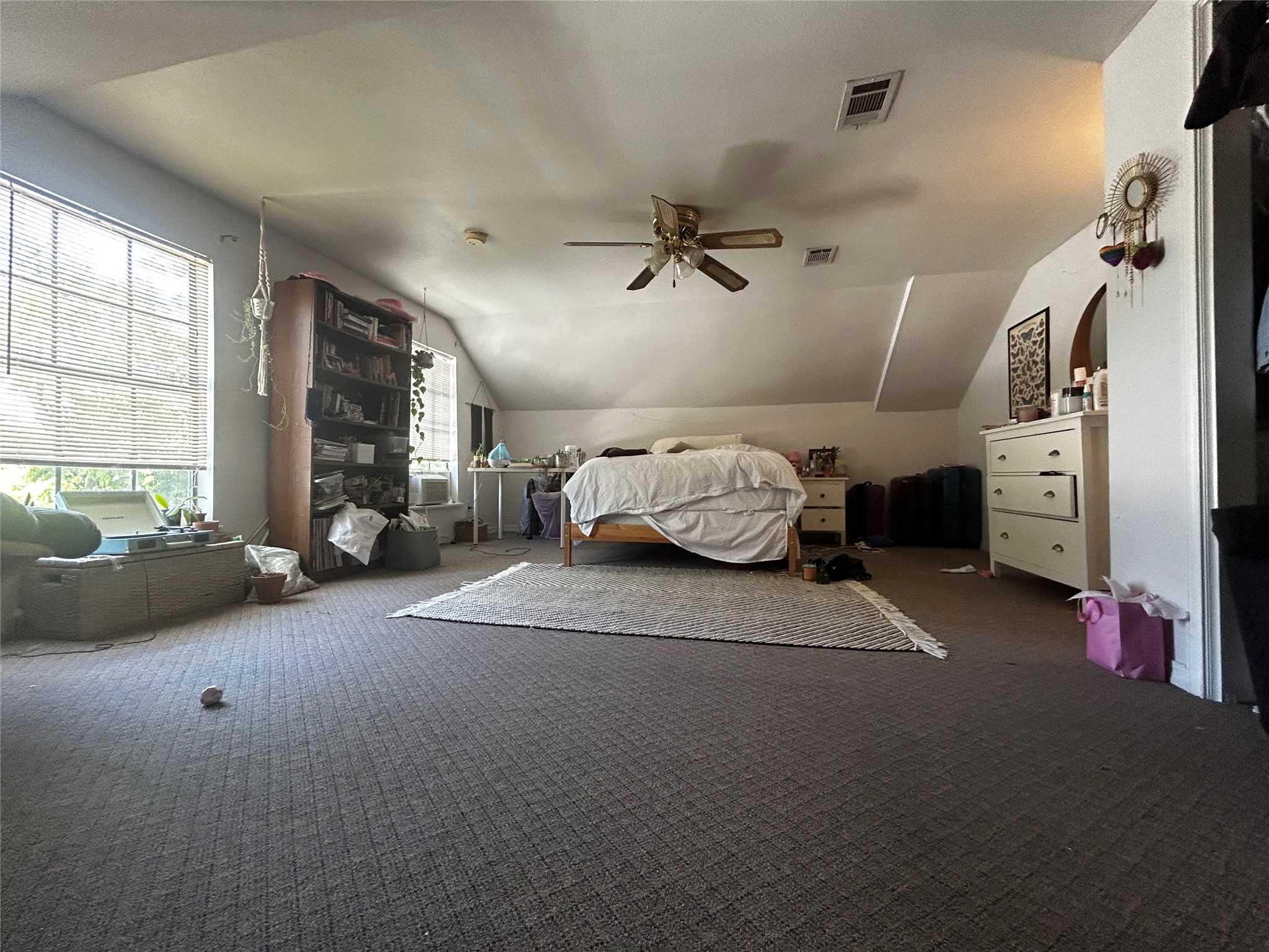 4511 Avenue B, Unit B Austin, TX 78751 - Photo 13 of 15 Bedroom featuring carpet flooring, lofted ceiling, and a ceiling fan