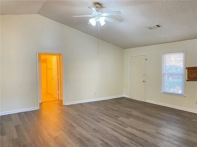 a view of a livingroom with a chandelier fan