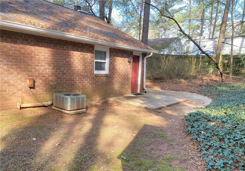 5458 Terrace Garden Way, Unit A Norcross, GA 30071 - Photo 25 of 27 a backyard of a house with barbeque oven and outdoor seating