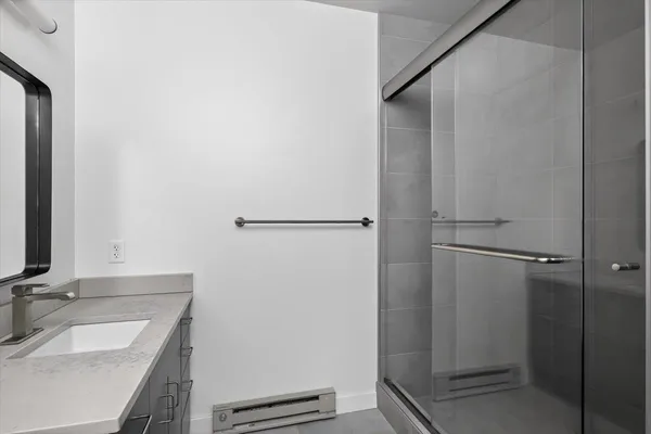 a bathroom with a sink and a mirror