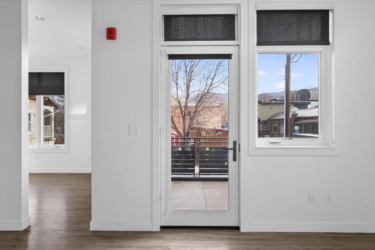 185 North Lena Street, Unit CONDO D Ridgway, CO 81432 - Photo 16 of 17 a view of an entryway with wooden floor and windows