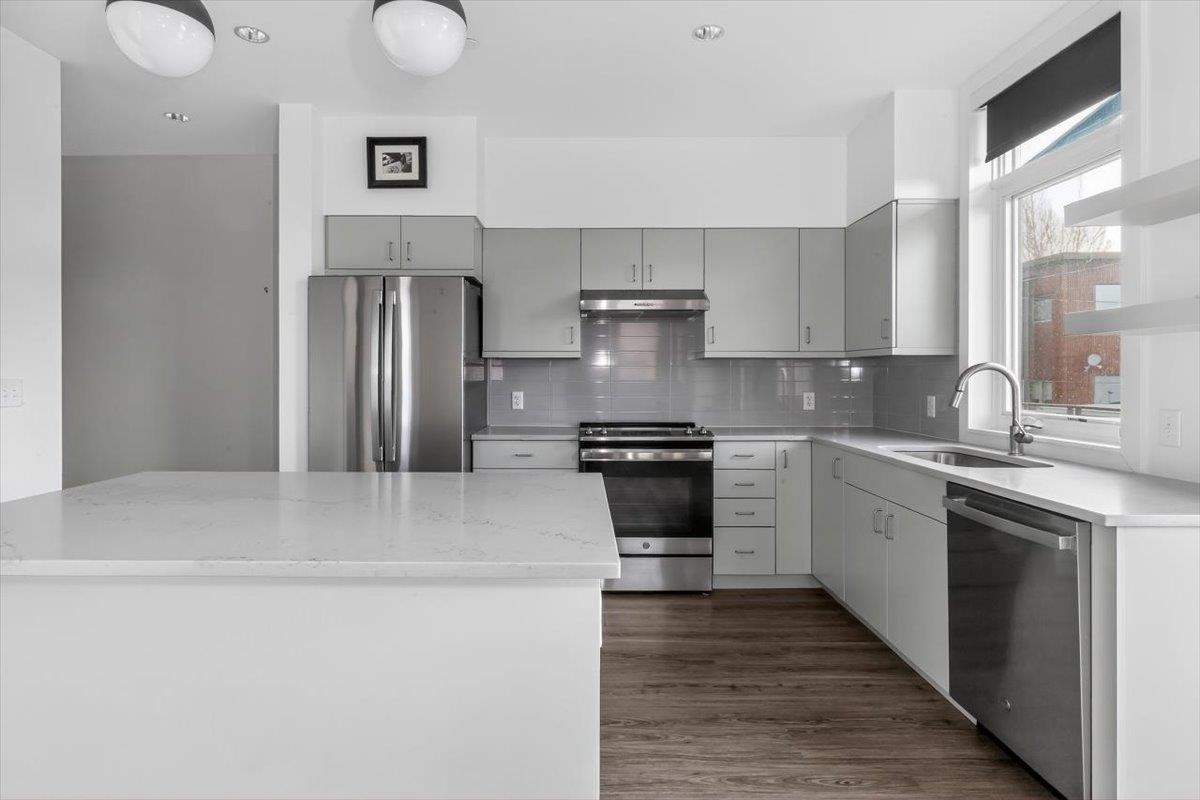185 North Lena Street, Unit CONDO D Ridgway, CO 81432 - Photo 4 of 17 a kitchen with stainless steel appliances granite countertop a sink stove and refrigerator