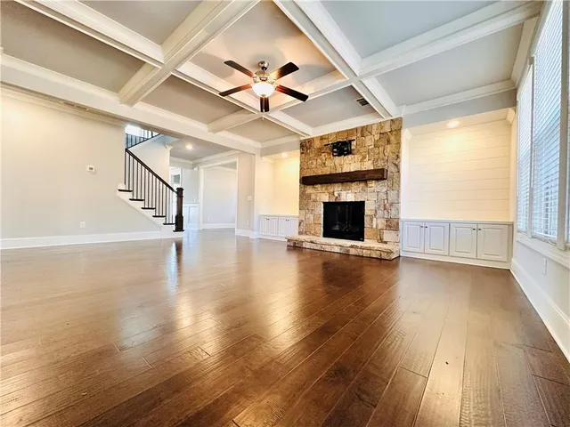 a view of a room with wooden floor