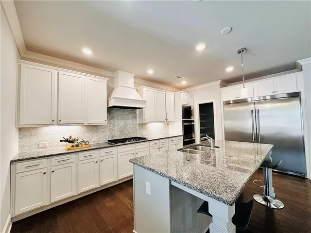 a spacious bathroom with a tub sink shower and mirror