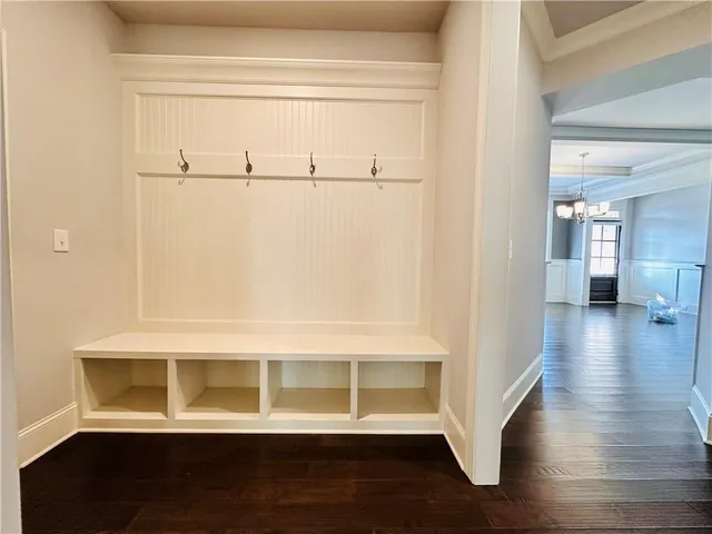 a spacious bathroom with a granite countertop sink mirror and a
