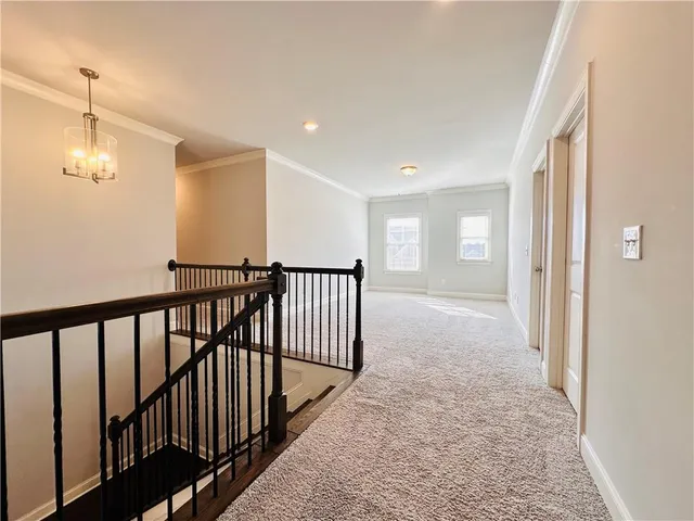 an empty room with a empty space and windows