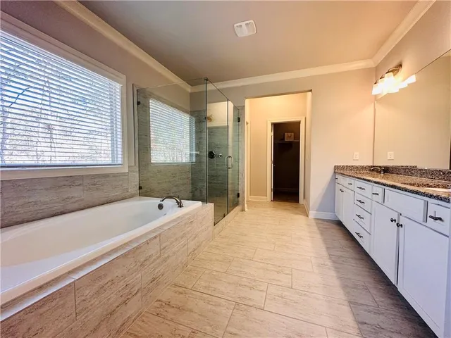 a bathroom with a shower and a toilet