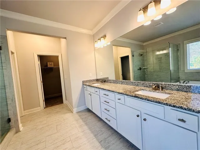 a view of a white house with a outdoor space