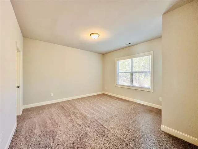 a view of a swimming pool with an outdoor seating