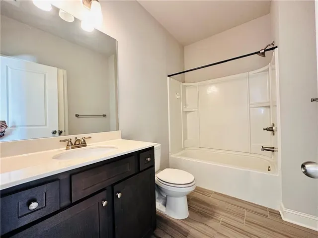 a backyard of a house with yard and outdoor seating