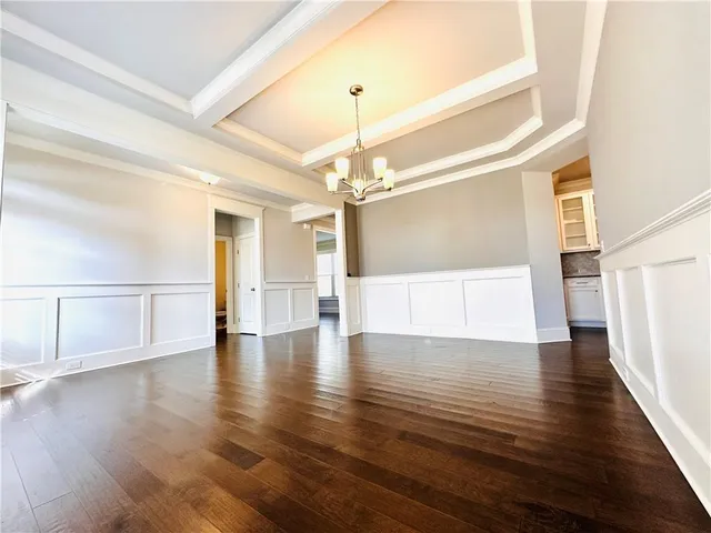 a view of an entryway with wooden floor