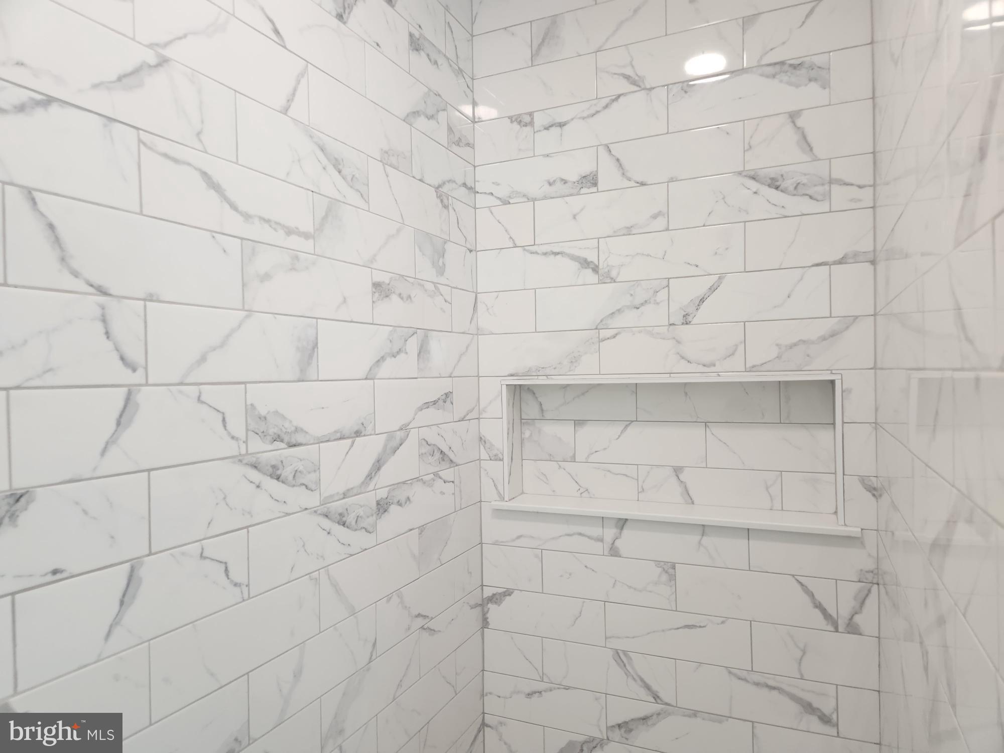 1929 Dunkleberger Road Elliottsburg, PA 17024 - Photo 25 of 48 Elegant marble-patterned shower walls.
