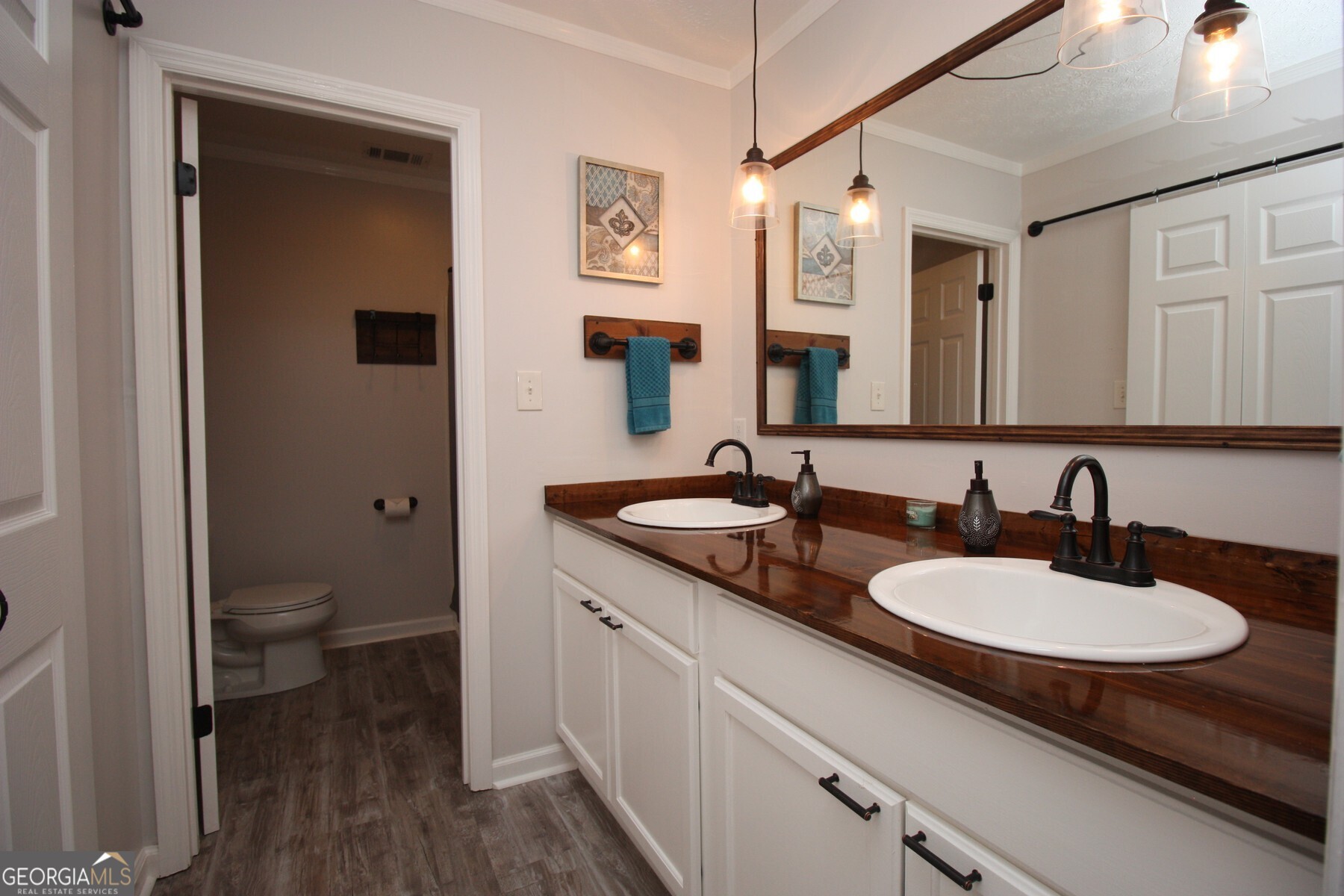231 Murphy Road LaGrange, GA 30240 - Photo 15 of 24 a bathroom with a granite countertop sink a toilet and a mirror