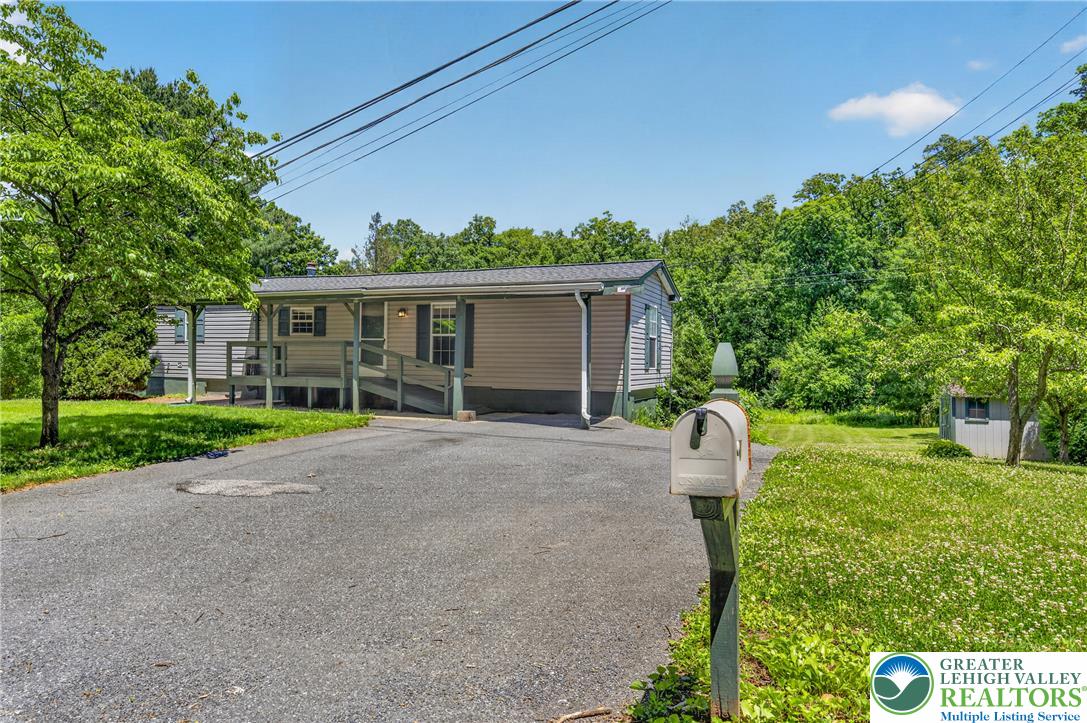 2674 Williams Road Danielsville, PA 18038 - Photo 2 of 31 A welcoming front exterior offers a paved driveway and mature trees.