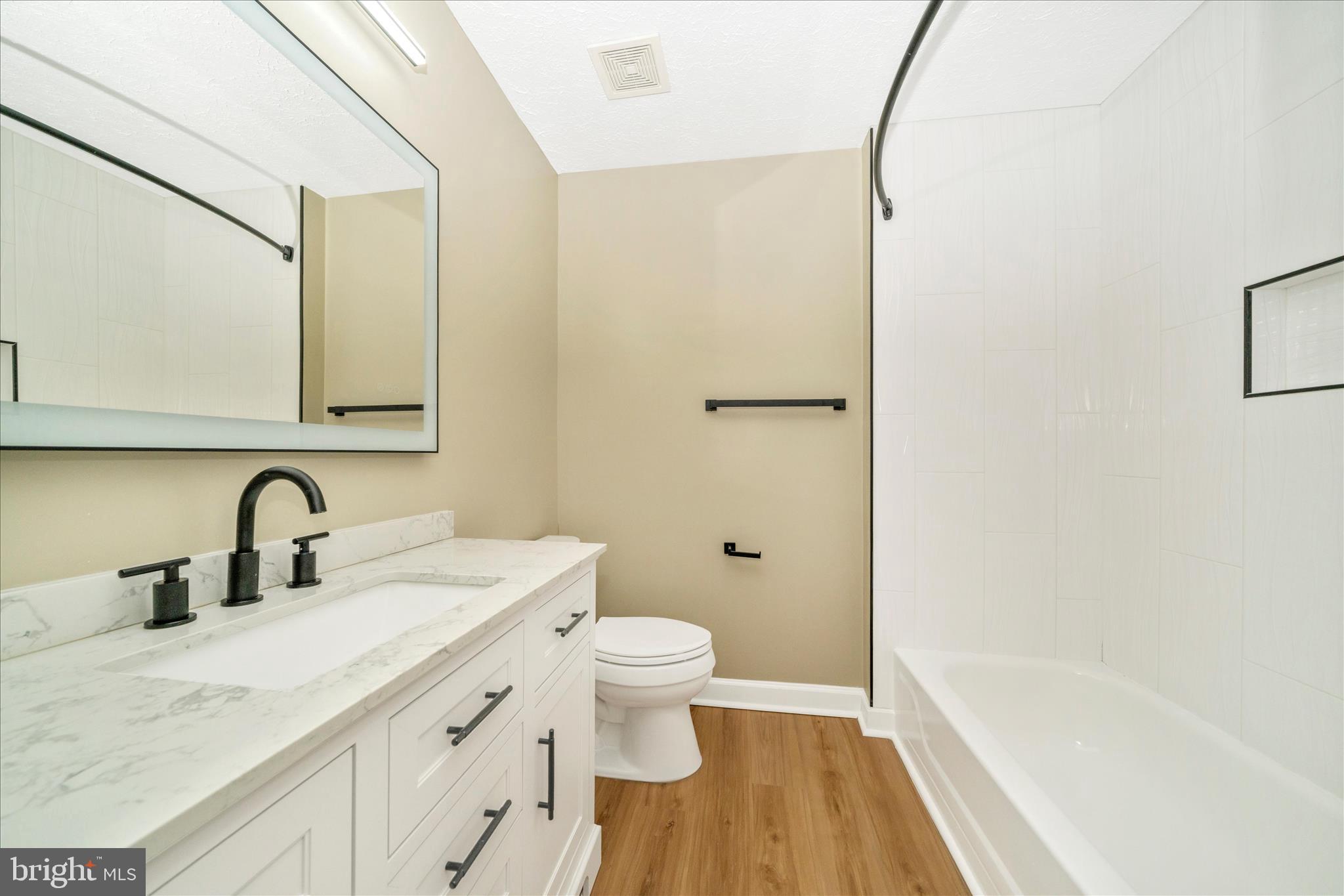 1810 Sebastian Boulevard Frederick, MD 21701 - Photo 16 of 28 a bathroom with a sink a toilet and a bathtub