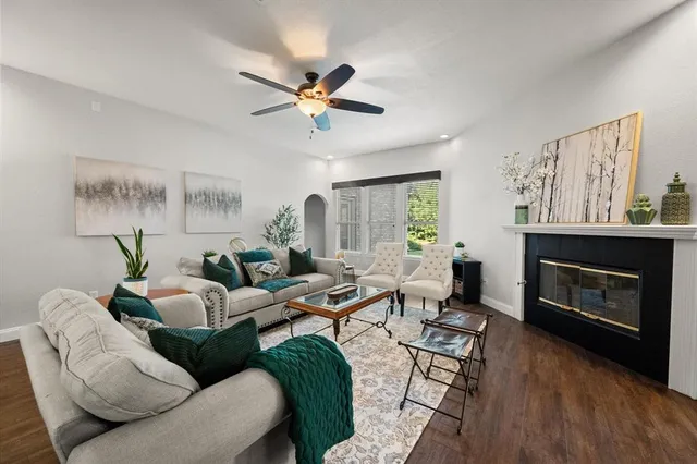 a living room with furniture and a fireplace