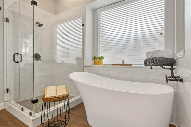 a bathroom with a bathtub and a sink
