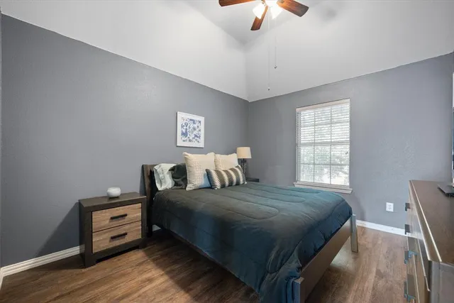 a bedroom with a bed and a tv