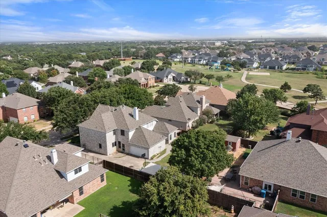 an aerial view of a house with a lake view