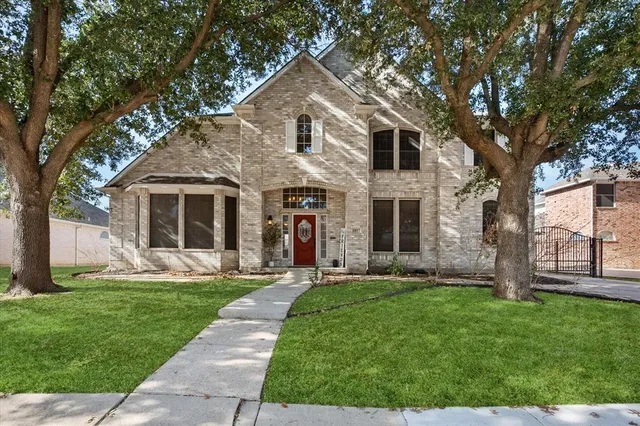 a front view of a house with a yard and porch