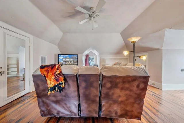 a view of a dining room with furniture wooden floor and chandelier