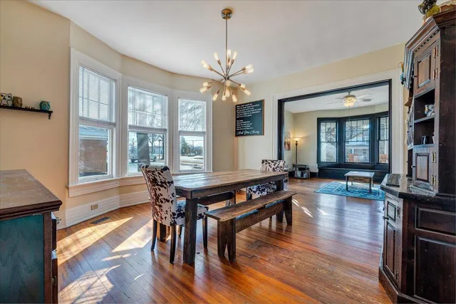 a view of a dining room with furniture window and wooden floor