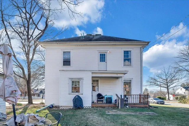 a bathroom with a sink a toilet and shower curtain