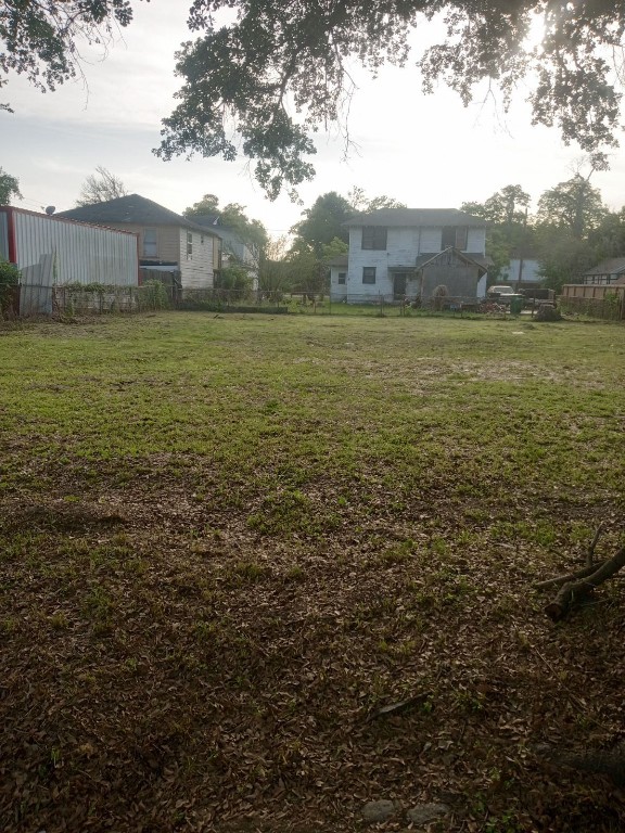 0 Carroll Oliver Way Houston, TX 77020 - Photo 3 of 7 a view of a lake with a yard