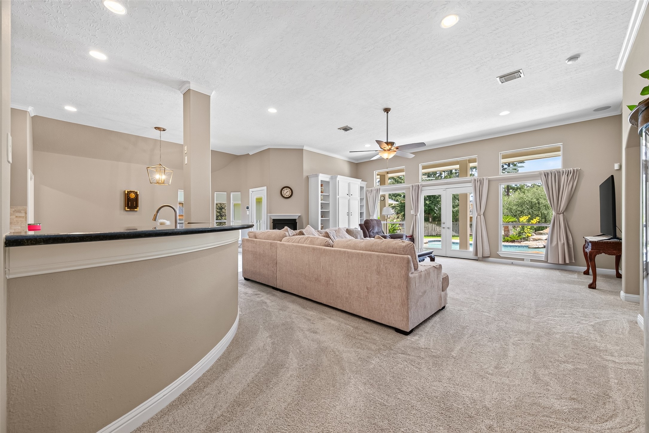 8114 Hideaway Run Way Spring, TX 77389 - Photo 13 of 37 Designed with graceful continuity, this expansive living space connects beautifully from one area to the next—creating an elegant setting for refined entertaining while effortlessly accommodating the everyday rhythm of a busy family.