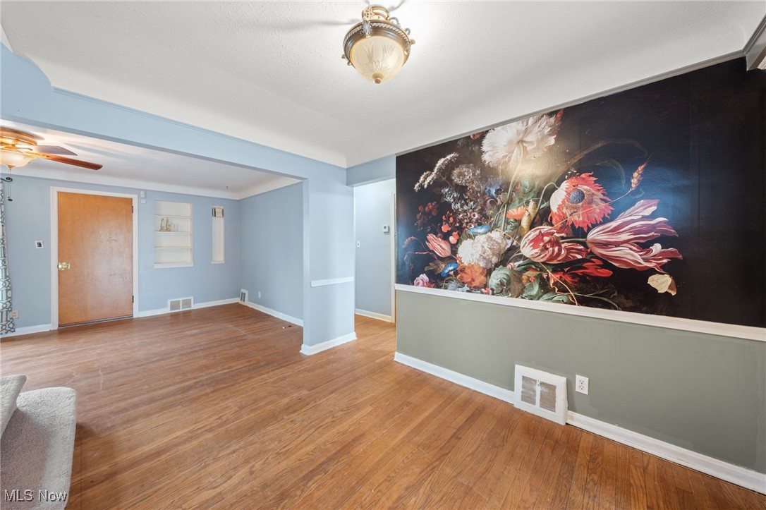 4146 Wyncote Road South Euclid, OH 44121 - Photo 6 of 20 Dining room with accent wall and hardwood floors