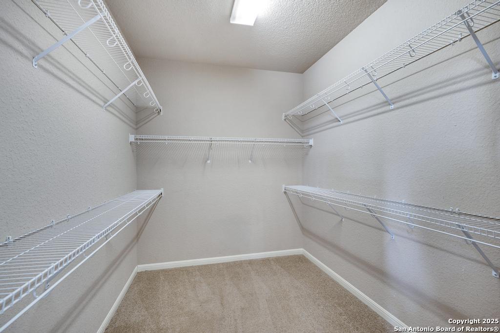 1934 Oak Flat Road San Antonio, TX 78251 - Photo 22 of 33 a view of a room with racks on the wall