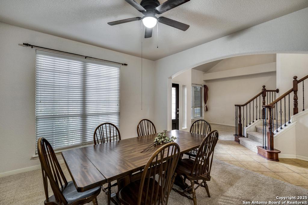 1934 Oak Flat Road San Antonio, TX 78251 - Photo 5 of 33 a view of a a dining room with furniture window and wooden floor