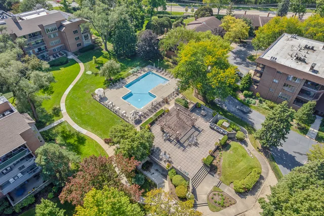 an aerial view of a house with a swimming pool
