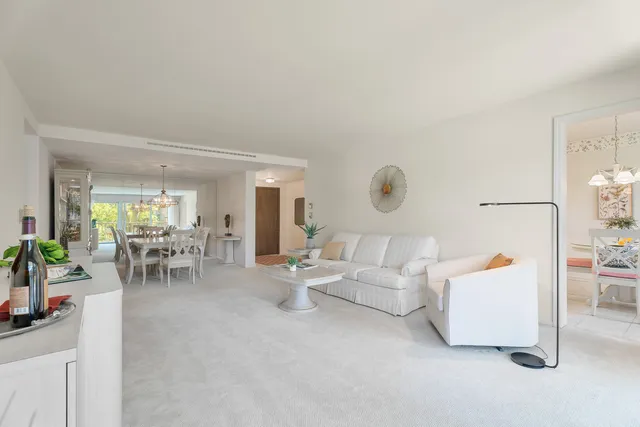 a living room with furniture and white walls