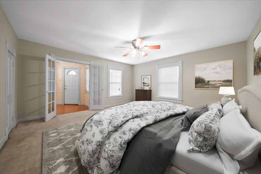 101 North 7th Street Krum, TX 76249 - Photo 11 of 26 Carpeted bedroom featuring ceiling fan and baseboards