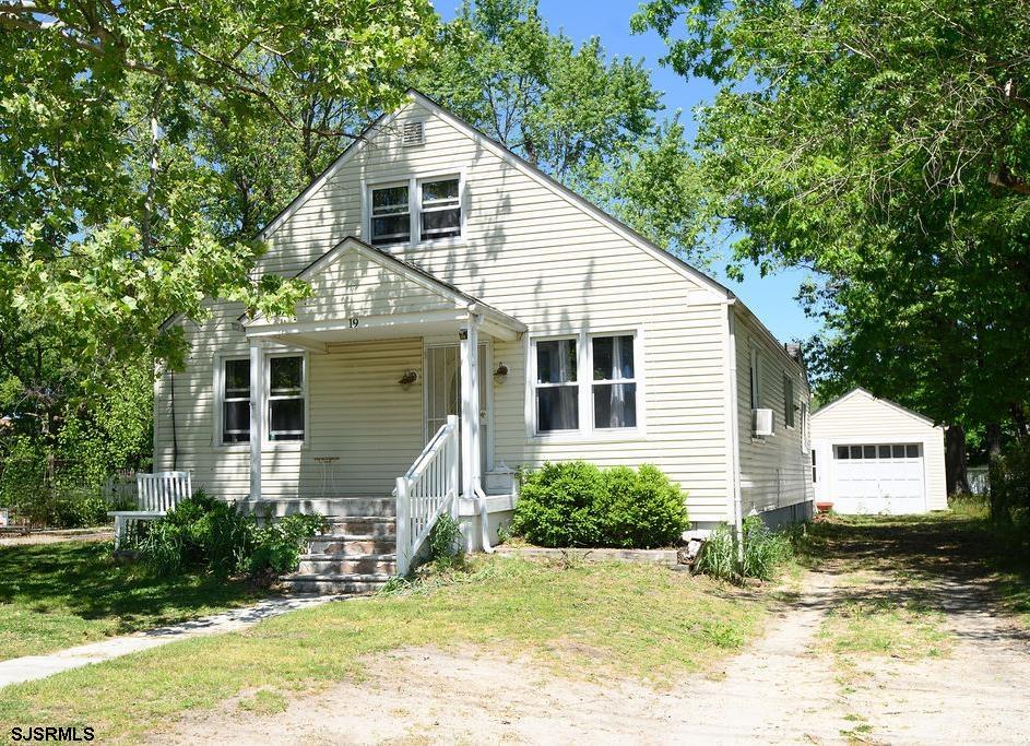 19 South 1st Road Hammonton, NJ 08037 - Photo 1 of 36 a front view of a house with a yard and potted plants