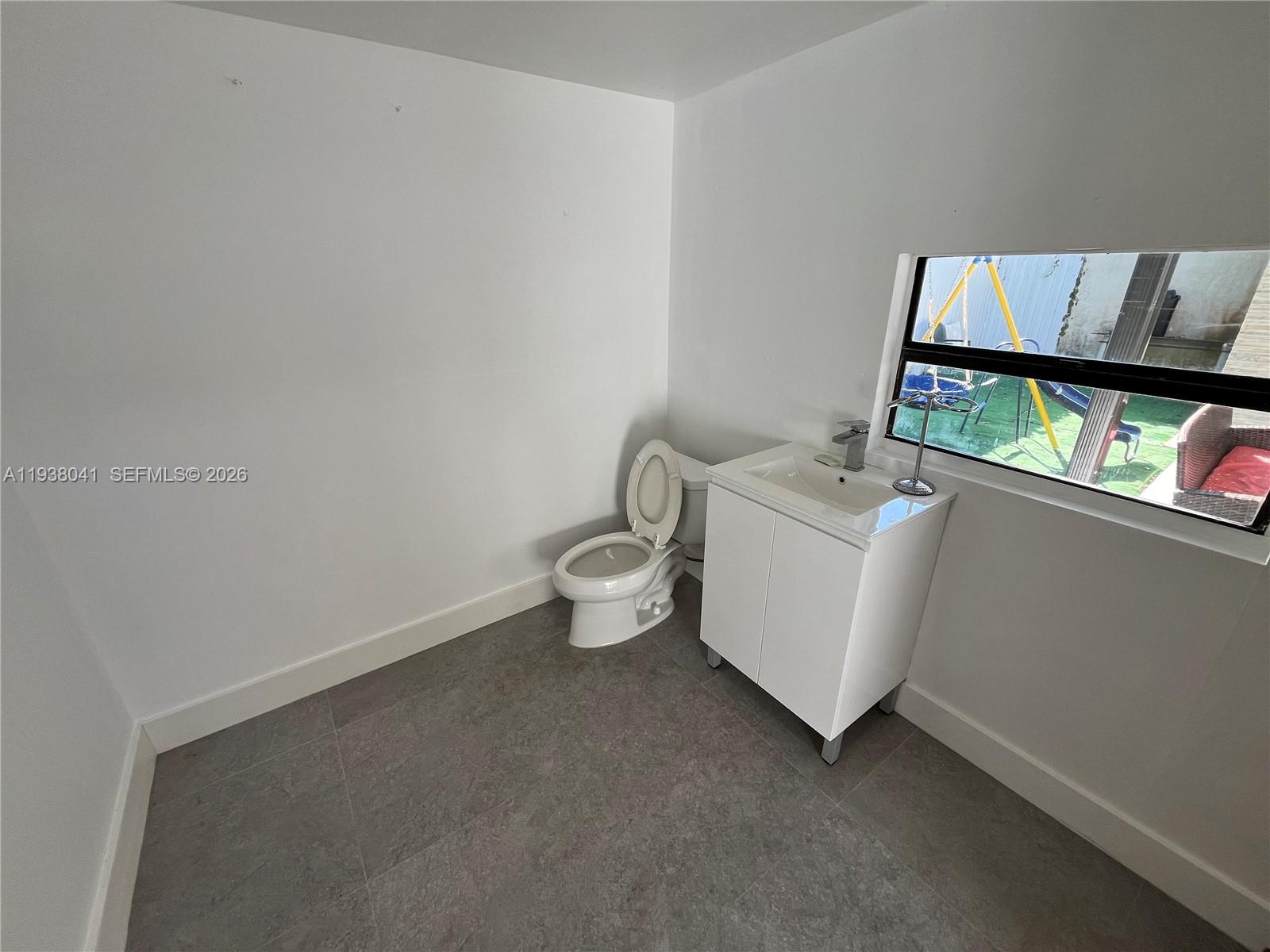 5803 Buchanan Street Hollywood, FL 33021 - Photo 11 of 14 a utility room with dryer and washer