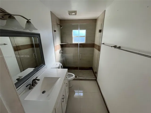 a bathroom with a sink and mirror