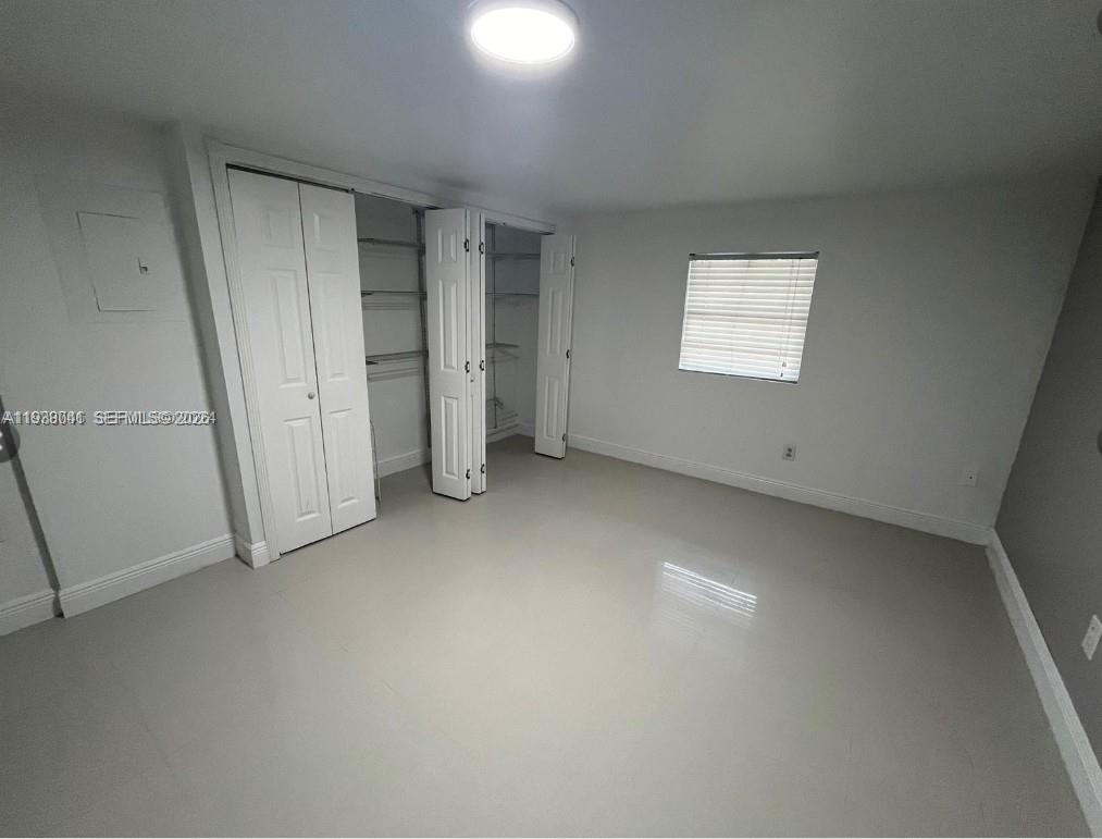 5803 Buchanan Street Hollywood, FL 33021 - Photo 9 of 14 an empty room with a empty space